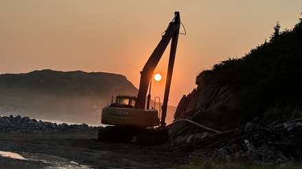 Long reach excavator on coastal marine works