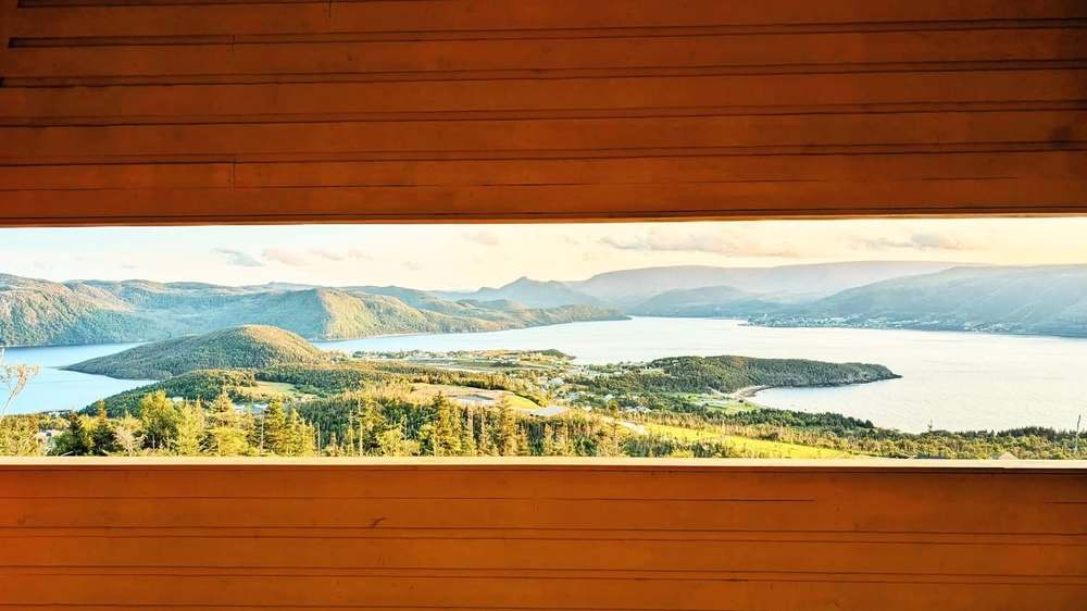 Bonne Bay framed through the timber viewing aperture at Seven Corners, built by Pittmans